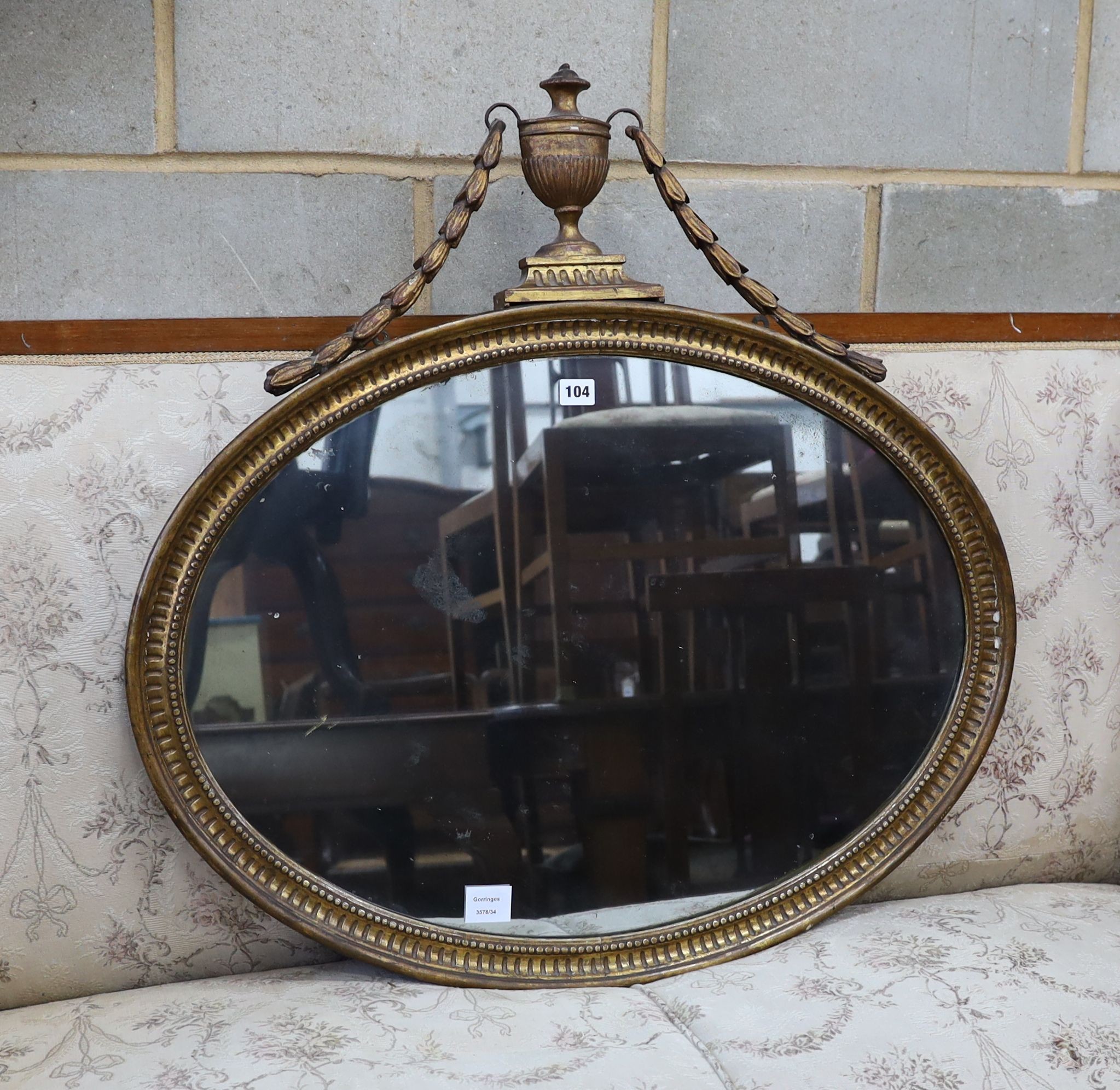 An Adam design oval giltwood wall mirror, width 81cm, height 81cm